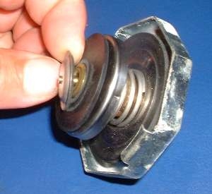 Radiator cap vacuum clearance valve